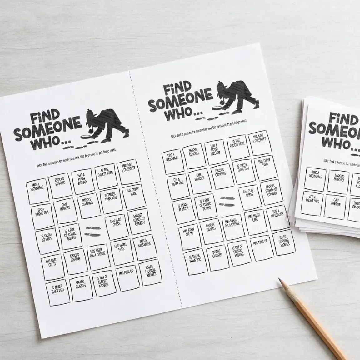 Example artwork for Get to Know you Bingo Icebreaker: a photograph of the printed sheet on a desk, cut and in use, made with Printable Game Maker